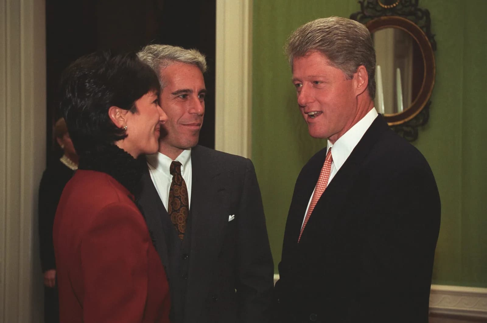 Bill Clinton speaking with Jeffrey Epstein and Ghislaine Maxwell at a White House donor reception in 1993