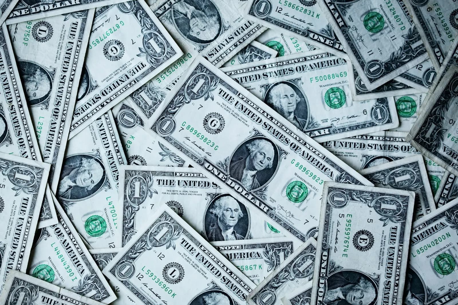 Financial documents and currency representing the mystery of Jeffrey Epstein's fortune and estate assets