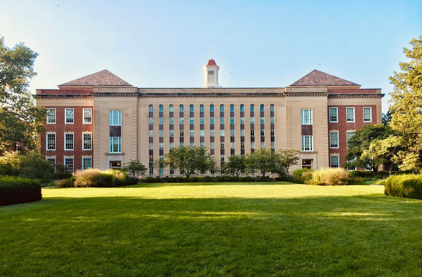 University campus buildings representing the academic institutions connected to Jeffrey Epstein through donations and relationships