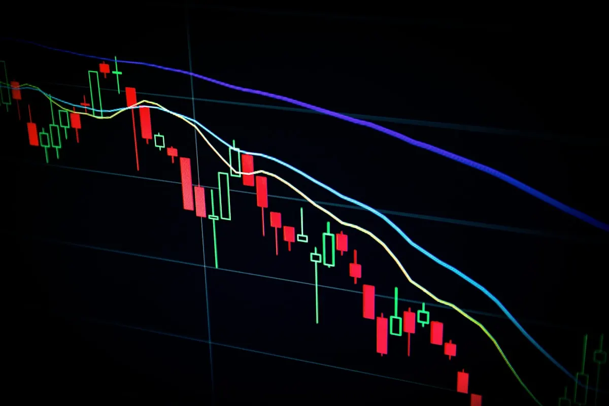 Financial trading screens representing Leon Black's Apollo Global Management and Epstein financial connections